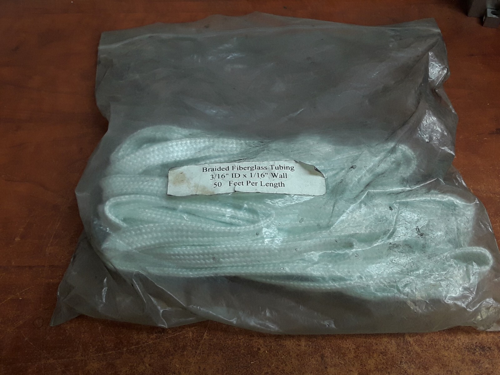 Braided Fiberglass Tubing 3/16″ ID x 1/16″ Wall – 50ft