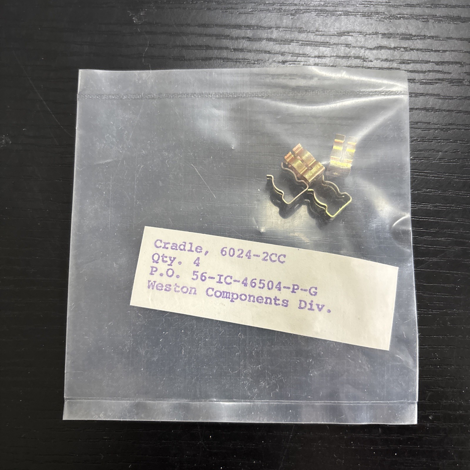 set of four “Cradle, 6024-2CC” parts manufactured by Weston Components Div.